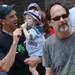 Pat Flaherty reacts to his 16-month-old son Eoin, both of Manchester, as he grabs hold of a popsicle as they beat the heat while Mitch Ryder performs during Sonic Lunch in downtown Ann Arbor on Thursday. Melanie Maxwell I AnnArbor.com